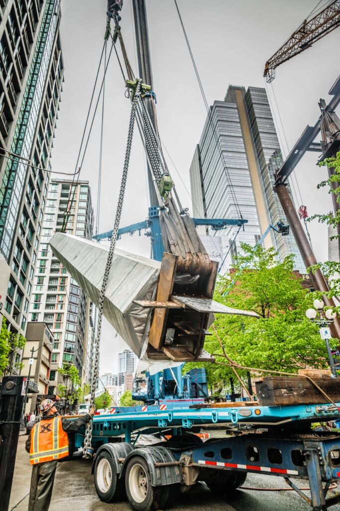 A heavy column being lifted by a crane, using rigging and lifting equipment from LGH.