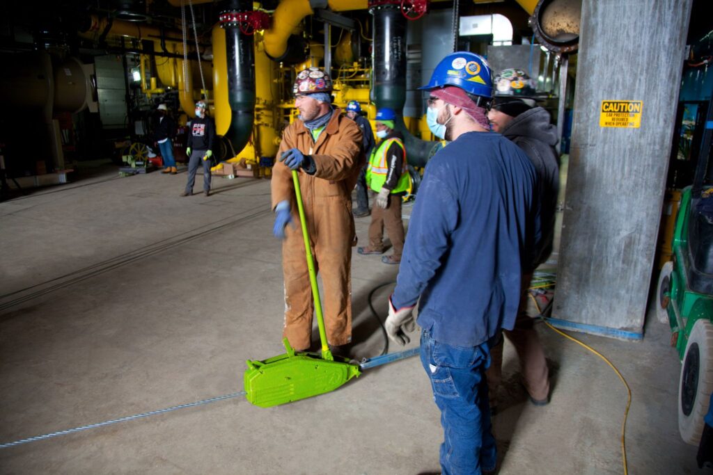 A Tractel Tirfor, aka a Griphoist, being used to move a chiller on an industrial jobsite in Chicago.