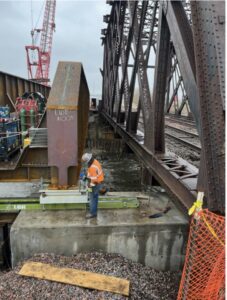 Moving bridge section with the Hydra-Slide HT500 Skidding System, a piece of railroad maintenance equipment..