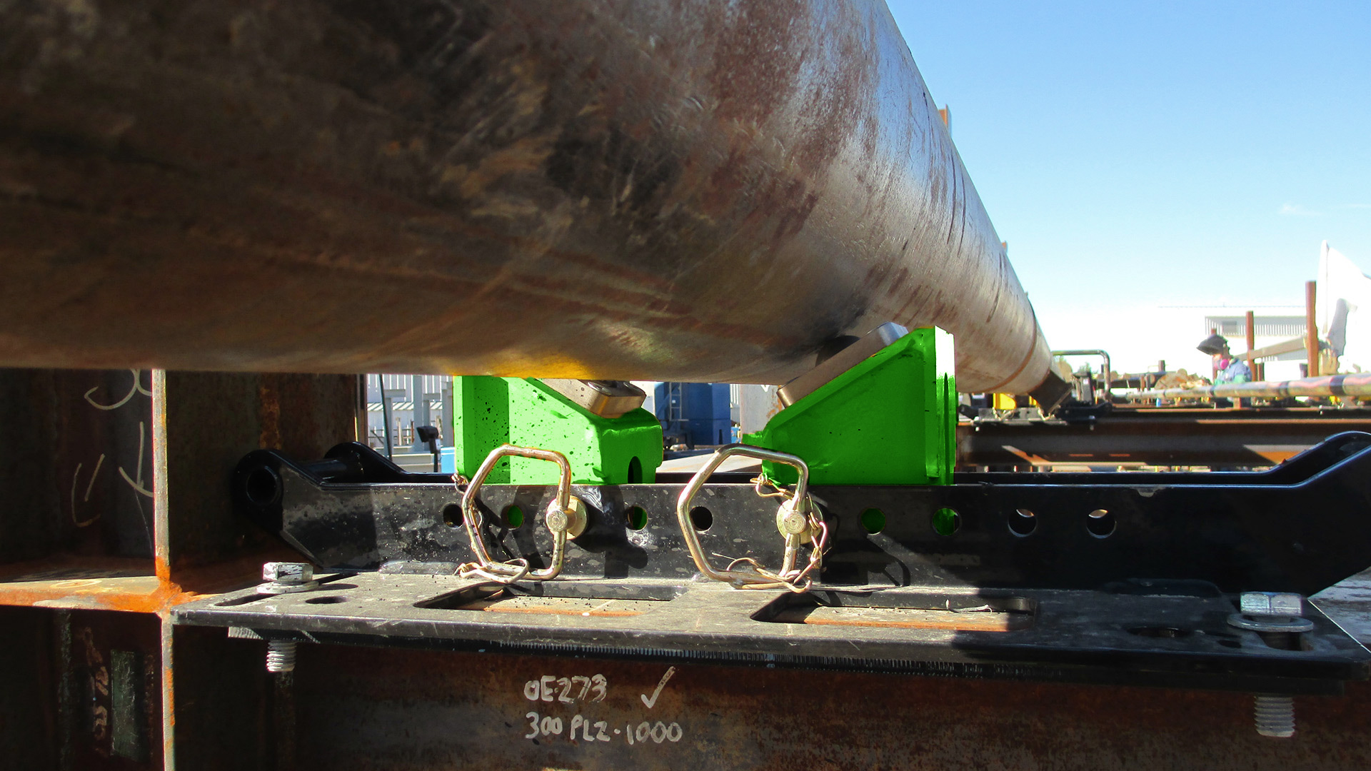 1 ton beam clamp pipe rollers from LGH being used on a jobsite.