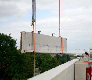 A close-up of our chain hoist guiding the spandrels into place.
